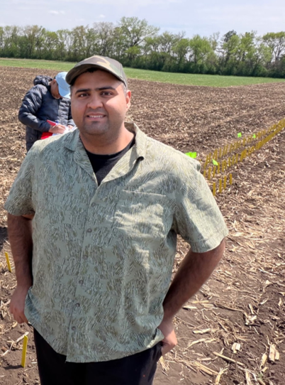 Arsalan Quresh in an agricultural field