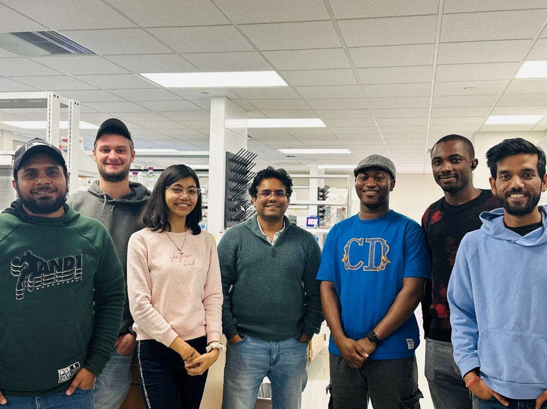 Solanki Lab group together in the laboratory